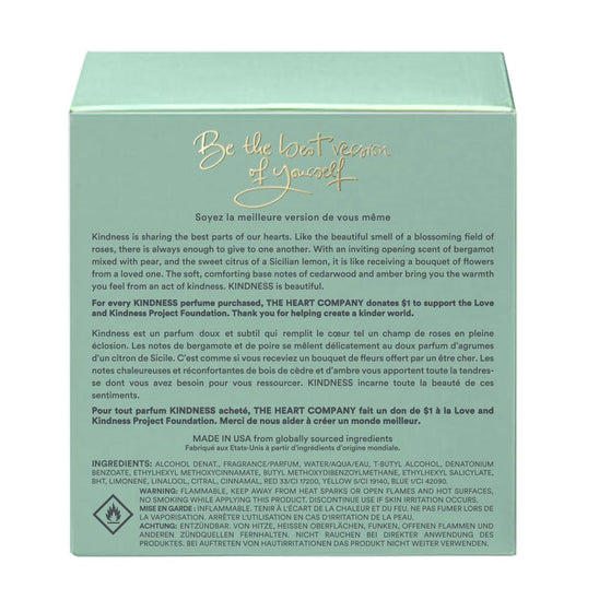 Back of Kindness in a Bottle perfume box by The Heart Company showing product description, fragrance story, ingredients, safety warnings, and “Made in USA” label on a mint green package for a vegan, cruelty-free unisex fragrance
