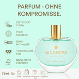 Perfume bottle labeled 'Kindness in a Bottle' with certification logos on a light green background