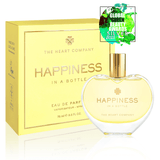Happiness in a Bottle perfume by The Heart Company in a heart-shaped glass bottle with gold cap, shown with yellow packaging and Global Green Beauty Awards Silver 2025 badge, representing joyful, uplifting fragrance and clean beauty
