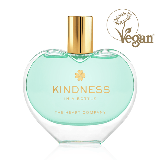 Kindness in a Bottle by The Heart Company in a heart-shaped clear glass bottle with a gold cap, a vegan and cruelty-free unisex fragrance that symbolizes kindness, positivity, and emotional wellness, featuring a fresh, woody notes

