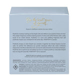 Back of Positivity in a Bottle perfume packaging by The Heart Company, showing product description, ingredients, and fragrance story for a fresh, aquatic, clean vegan perfume with citrus, white florals, and ocean breeze notes, paraben-free and phthalate-free