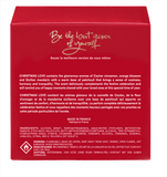 Back of Christmas Love vegan eau de parfum packaging by The Heart Company, showing fragrance description, ingredients, made in France details, and safety information on a red and gold gift box