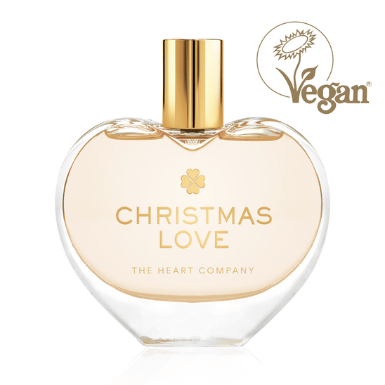 Christmas Love vegan eau de parfum by The Heart Company in a clear glass, elegant heart-shaped bottle with a golden cap, cruelty-free fragrance for holiday gifting and self-care