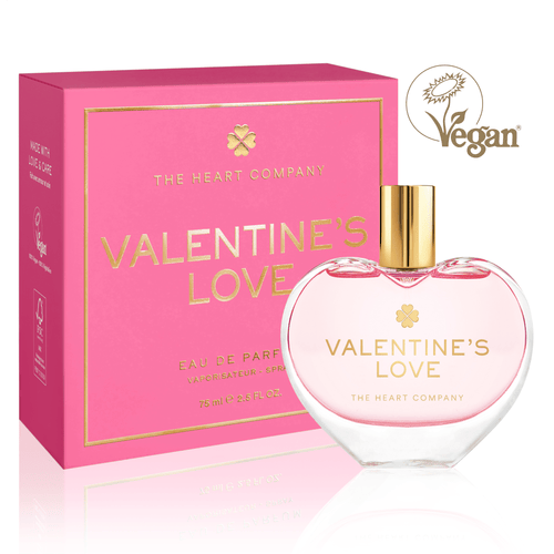 Valentine’s Love vegan eau de parfum by The Heart Company in a clear glass, elegant heart-shaped bottle with a golden cap, shown with pink gift box, cruelty-free fragrance for Valentine’s Day gifting