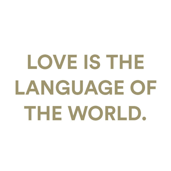 Inspirational quote reading ‘Love is the language of the world’ in soft neutral typography for fragrance branding and romantic lifestyle design.